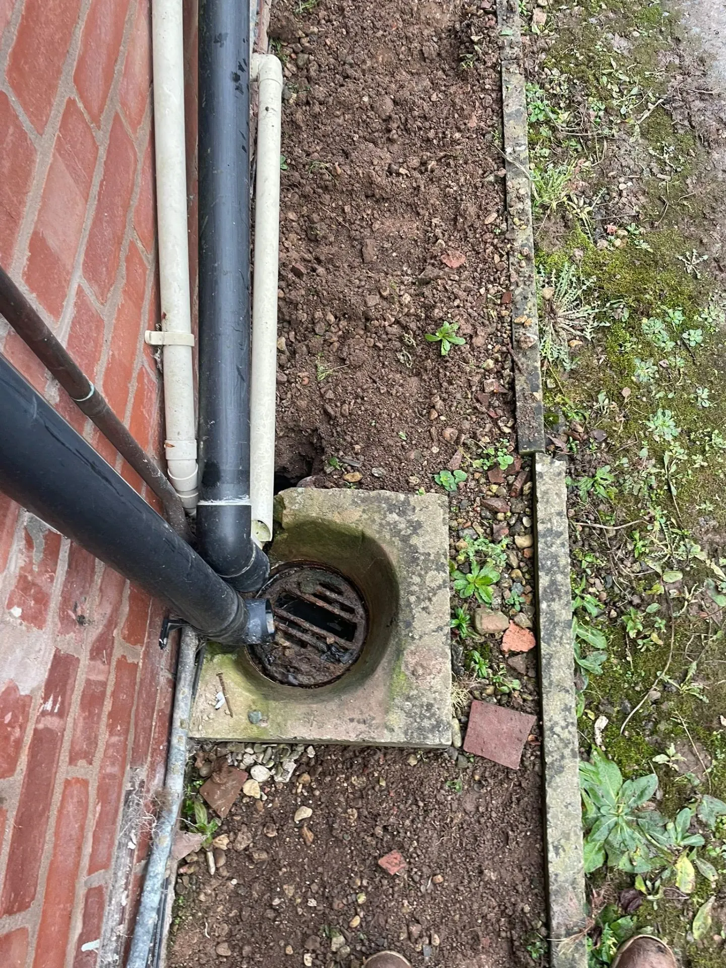 High-pressure jetting unit clearing a blocked drain